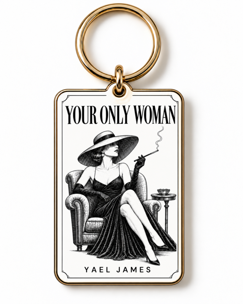 White YOUR ONLY WOMAN keyring by YAEL JAMES with a gold-tone ring and frame and a vintage illustration of a seated woman in a wide-brimmed hat.