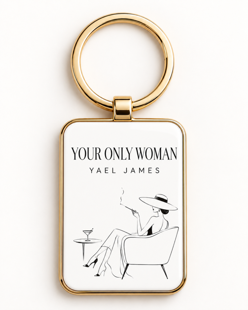 White YOUR ONLY WOMAN Line Art Keyring by YAEL JAMES with a seated-woman illustration and a gold-tone frame and ring.