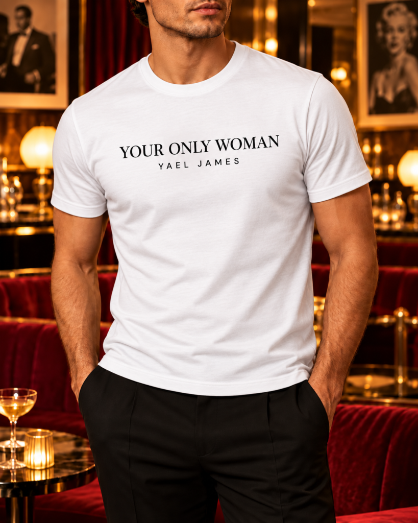 YAEL JAMES YOUR ONLY WOMAN men's T-shirt in white, front view worn by a model in a vintage lounge.