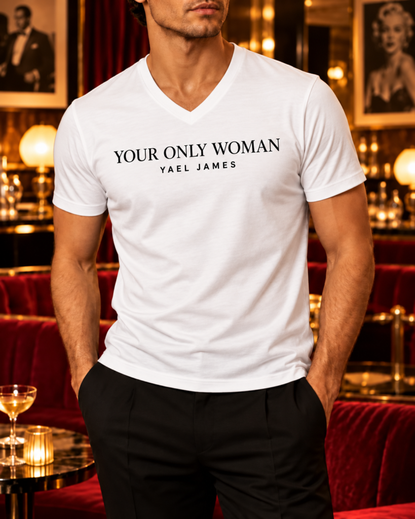 YAEL JAMES YOUR ONLY WOMAN men's V-neck shirt in white, front view worn by a model in a vintage lounge.