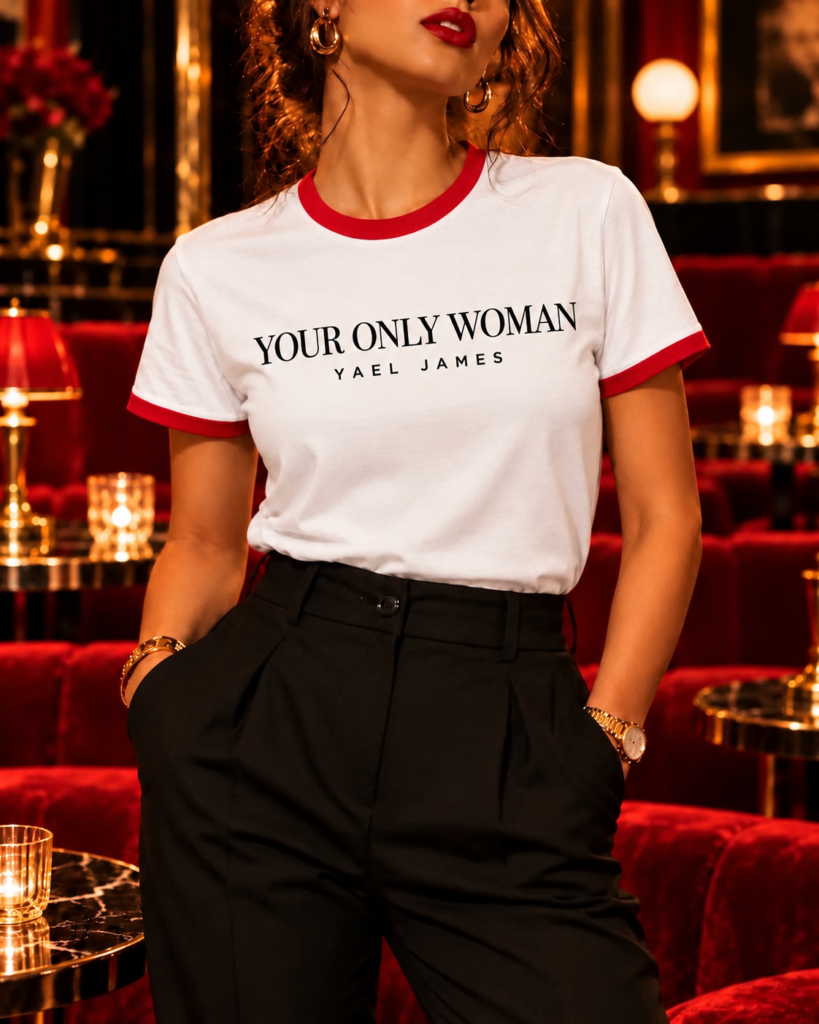 White YOUR ONLY WOMAN ringer T-shirt for her by YAEL JAMES with red neckline and sleeve cuffs, worn by a model cropped from her red lips down.
