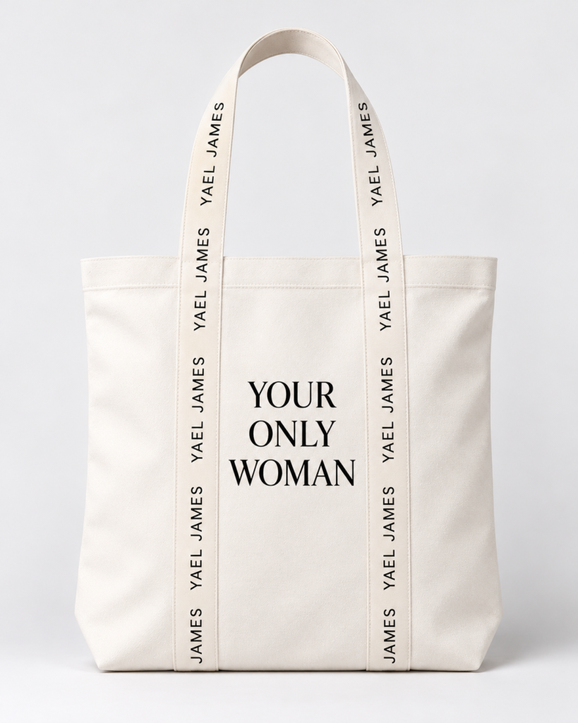 YOUR ONLY WOMAN tote bag by YAEL JAMES, white with cream branded straps, shown against a light background.